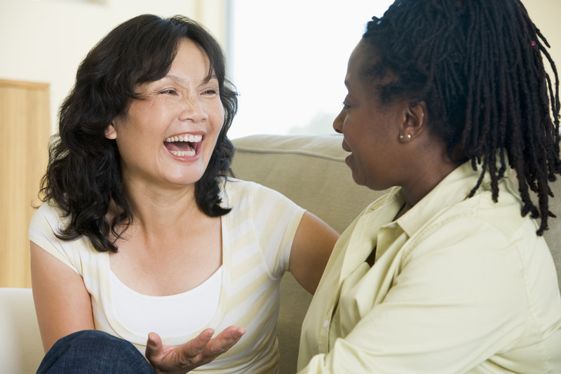 Asian and black women conversing